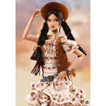Barbie doll in a cowgirl outfit with a hat and fringes on a plain background. JHDFASHIONDOLL Yellowstone: Farm Girl Candice - VIP Club Exclusive (M2514)