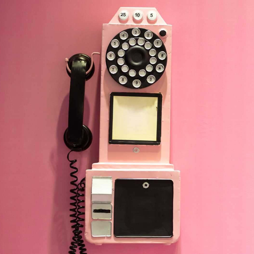 contact us here at simon's collectibles. retro phone image.