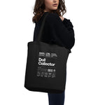 Black tote bag with 'Doll Collector' text and graphics worn by a person on a white background. 'Doll Collector' Product Label Design Organic Cotton Tote Bag for Adult Collectors