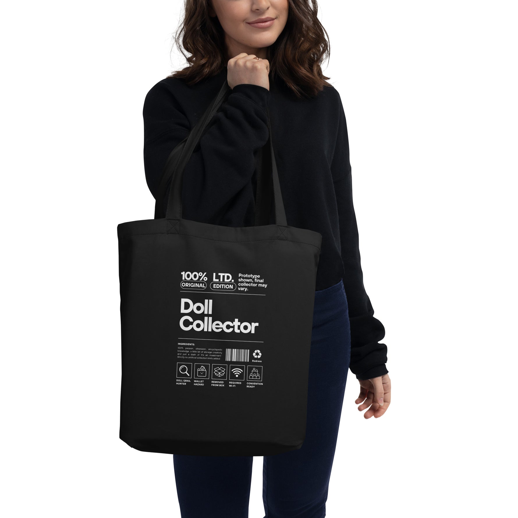 Person holding a black tote bag with 'Doll Collector' text and graphics.'Doll Collector' Product Label Design Organic Cotton Tote Bag for Adult Collectors