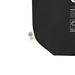 Black product with a green label on a white background. 'Doll Collector' Product Label Design Organic Cotton Tote Bag for Adult Collectors