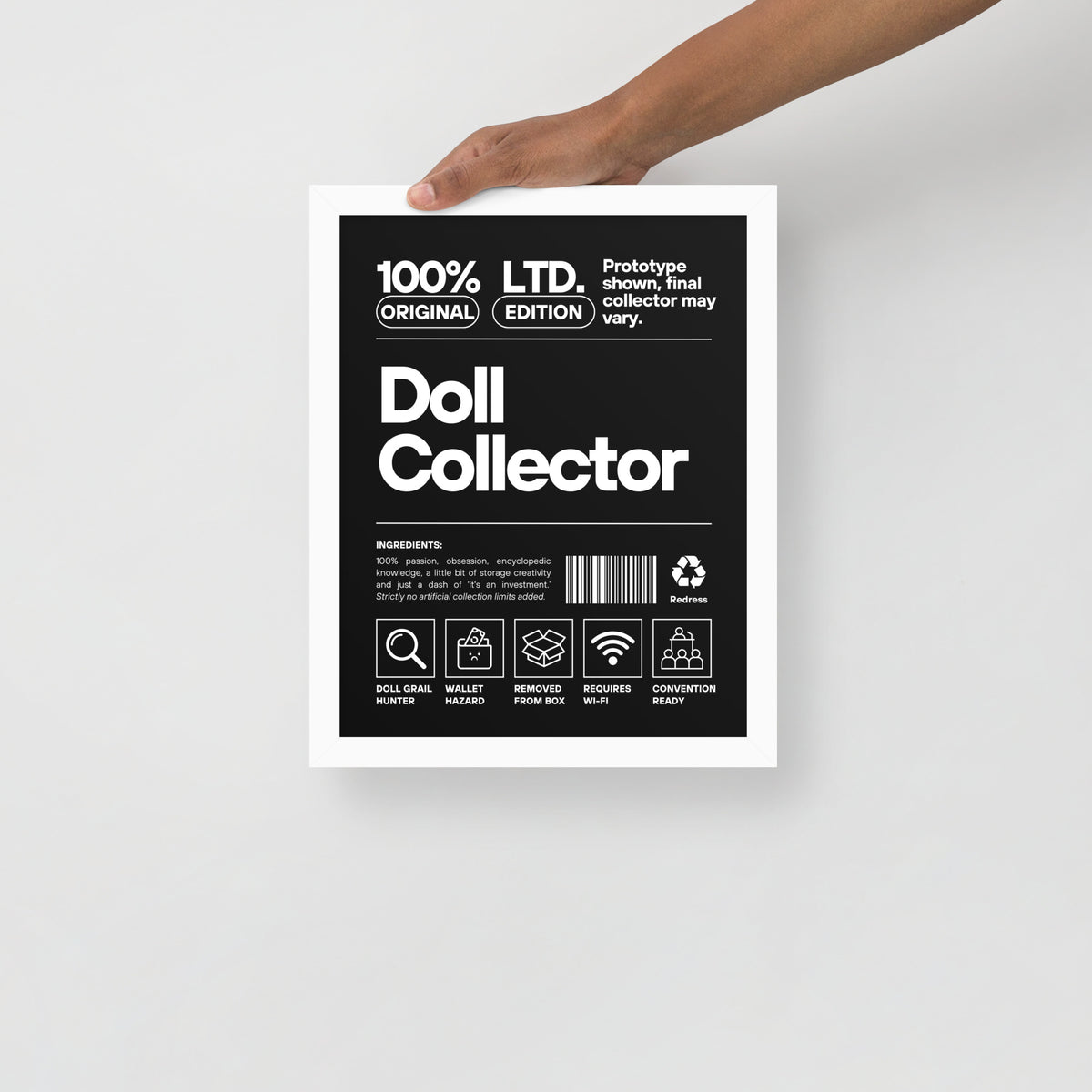 Product packaging for 'Doll Collector' with a hand holding it on a light gray background. 'Doll Collector' Product Label Design Framed Print - 11″ × 14″ (27.9 cm × 35.6 cm) Wall Art for Adult Collectors