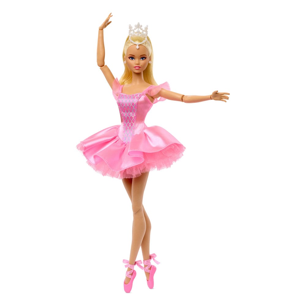 Barbie doll in a pink dress with a tiara on a white background