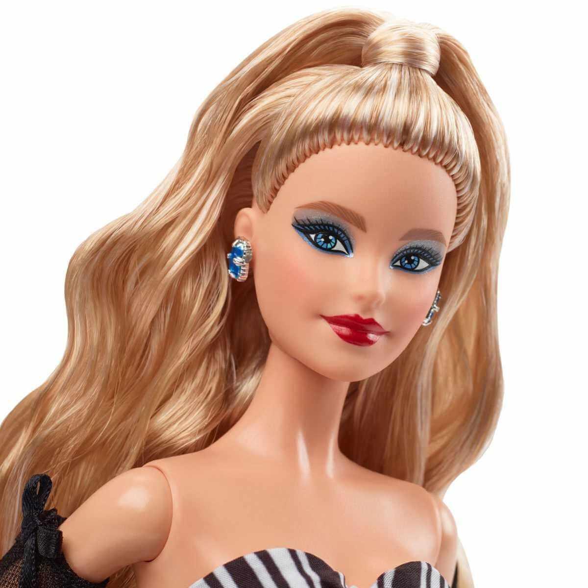 Barbie 65th Blue Sapphire Anniversary Doll with Blonde Hair by Barbie in the at Fashion Dolls section at Simon's Collectibles based in the UK.